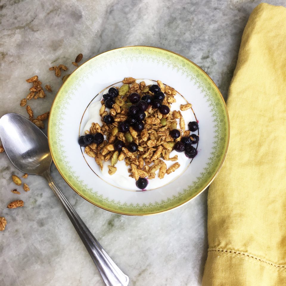 Granola sprinkled over Kite Hill almond yogurt and blueberries!