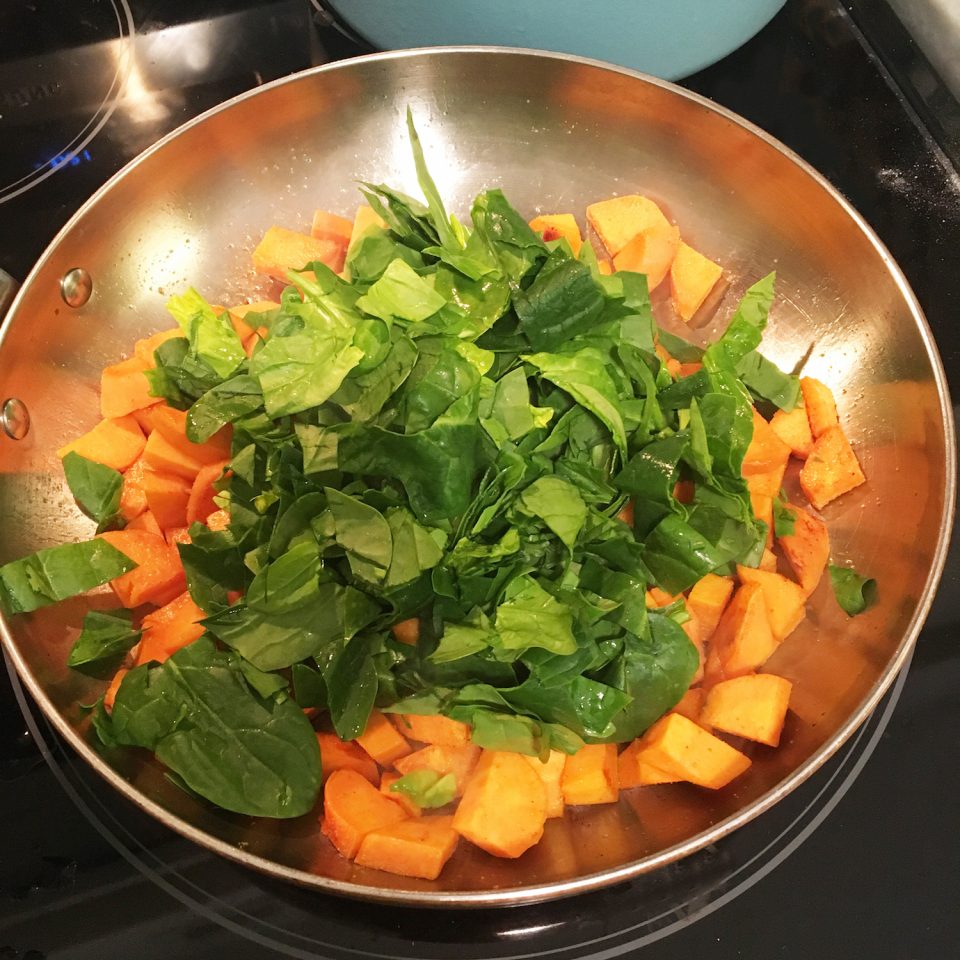 Sweet potatoes are almost ready so I add in the chopped spinach.