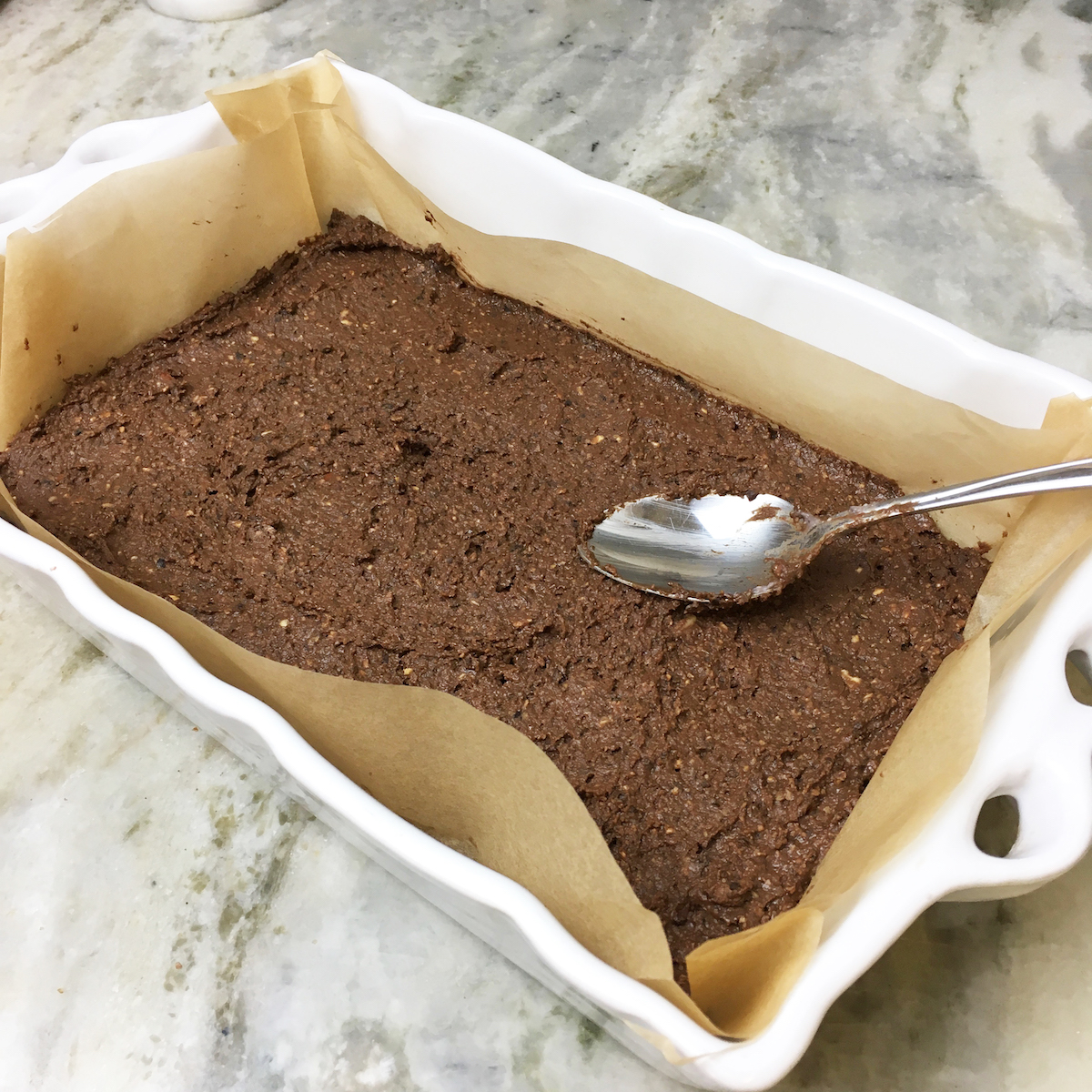 The batter will be very thick so using a spoon to help smooth it out better.