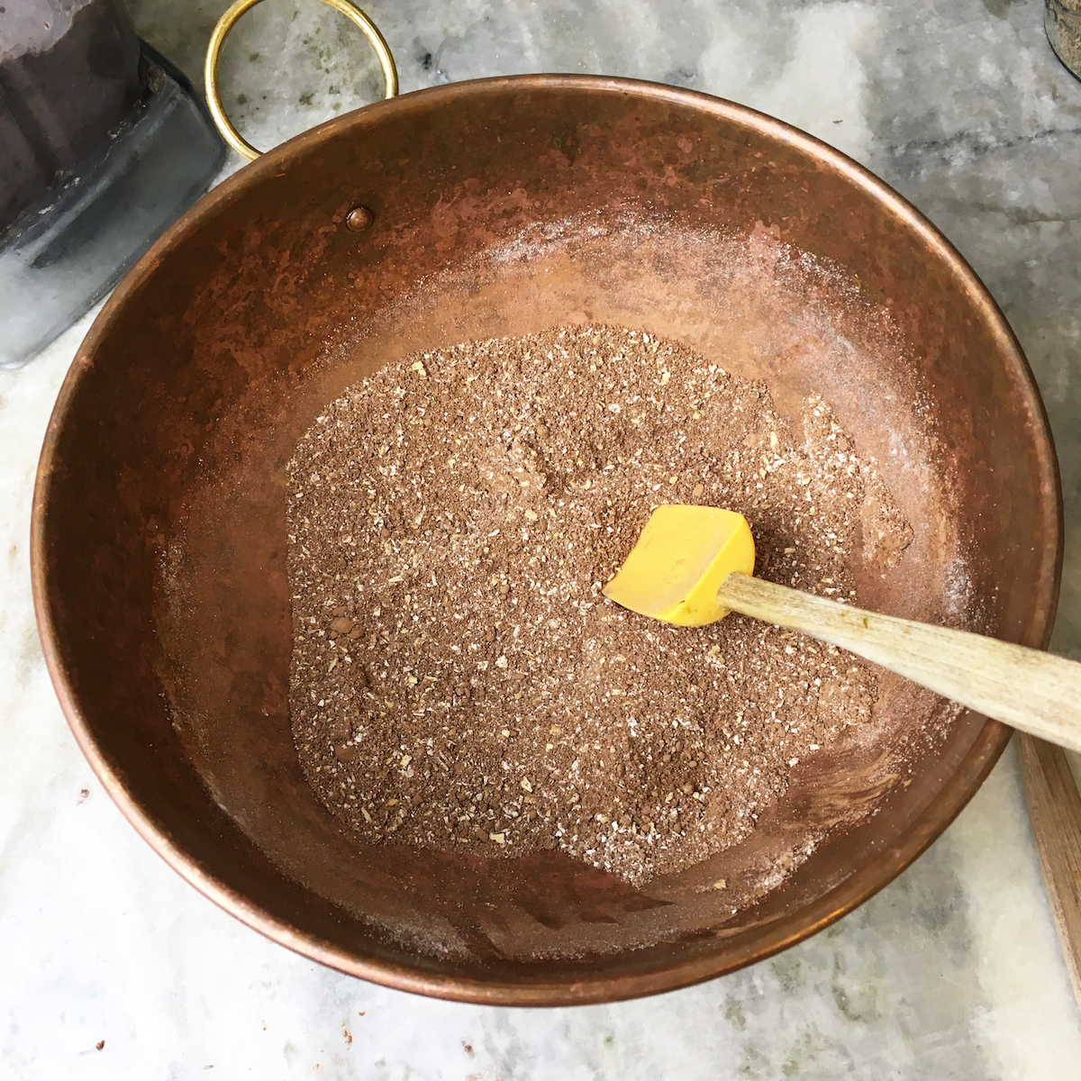 Dry ingredients for the black bean brownies are ready to be merged with the wet ingredients.