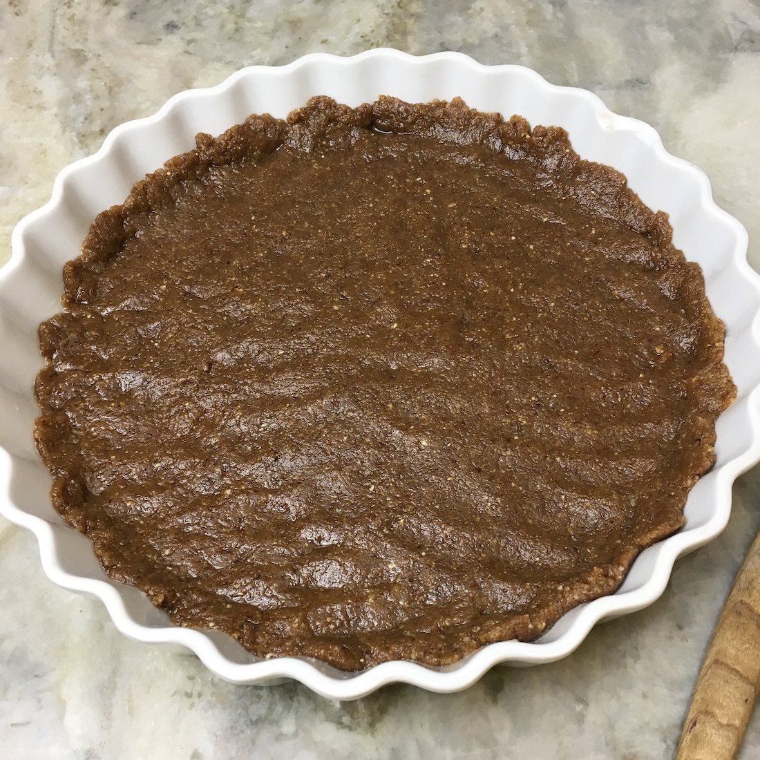 Pat out the pecan crust in a lightly greased pie dish. 