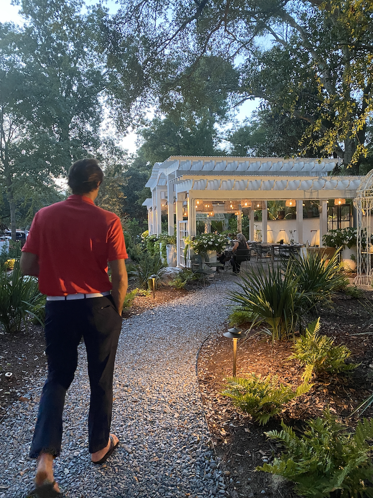 My husband walking through the garden at Kipos Hellenic Cuisine