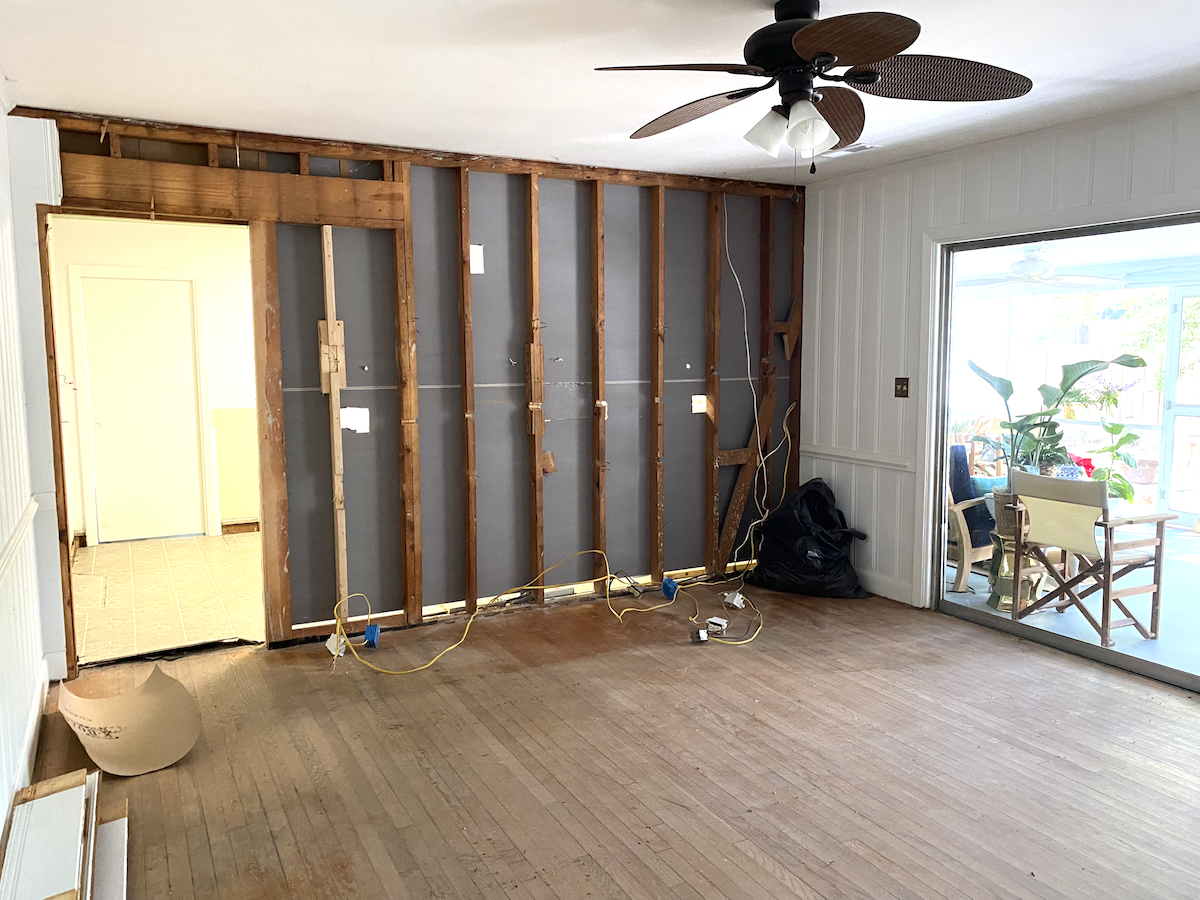 Carpet pulled up, exposing the hardwood floors found underneath!